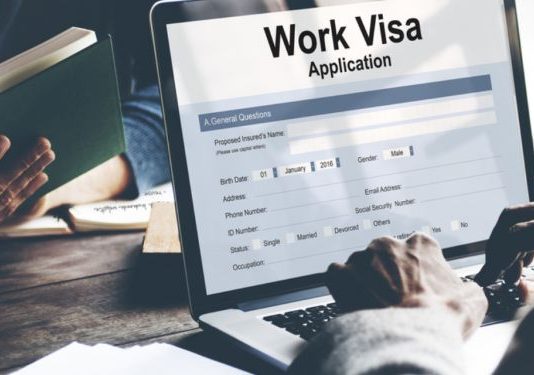 A person is filling Working Visa Application for Germany