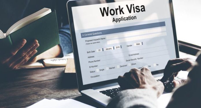 A person is filling Working Visa Application for Germany